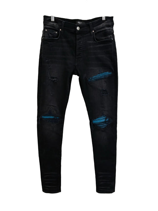Amiri MX1 Cracked Paint Jeans In aged Black With Blue Patches