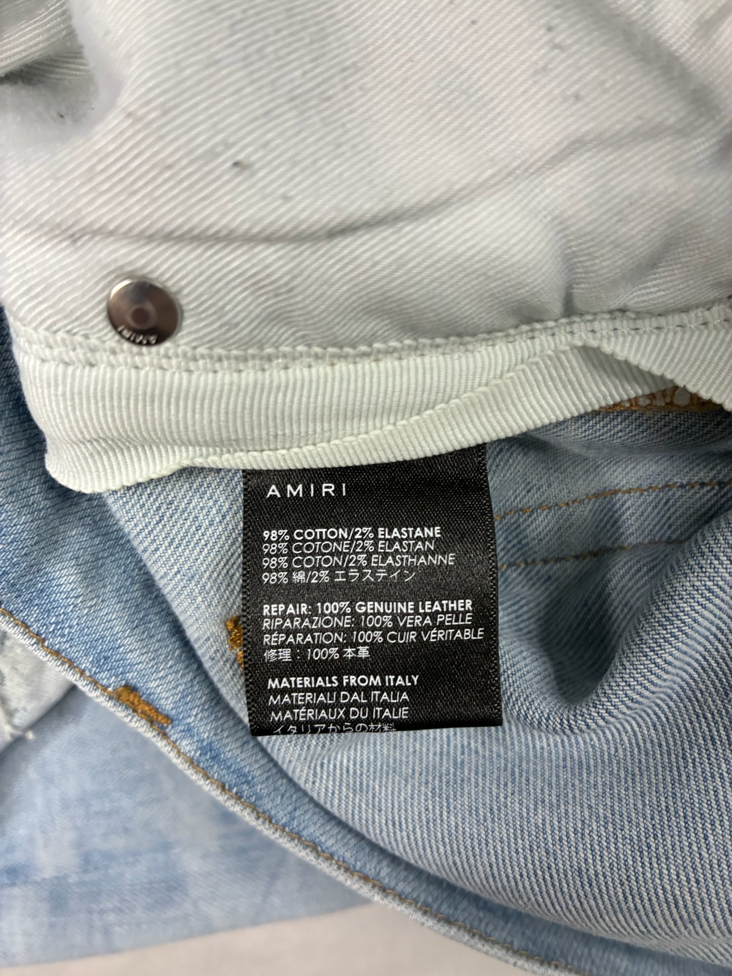 AMIRI MX1 White Patch Distressed Jean