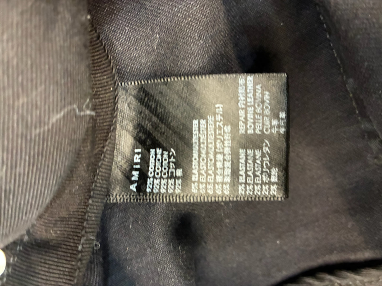 Amiri MX1 Cracked Paint Jeans In aged Black With Blue Patches