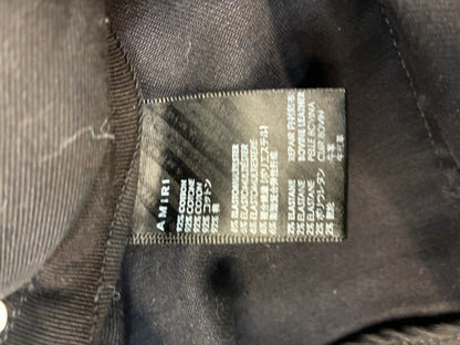 Amiri MX1 Cracked Paint Jeans In aged Black With Blue Patches