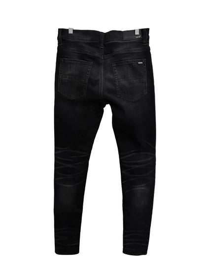 Amiri MX1 Cracked Paint Jeans In aged Black With Blue Patches