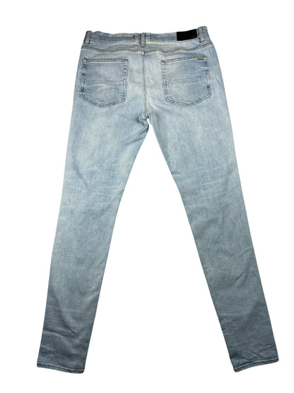 AMIRI MX1 White Patch Distressed Jean